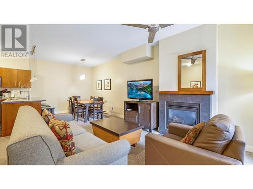 2049 Summit Drive Unit# 214, Panorama, BC - Indoor Photo Showing Living Room With Fireplace