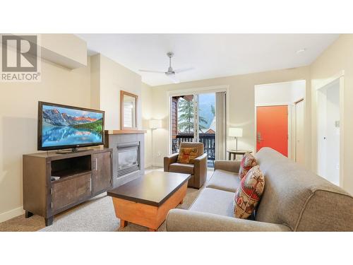 2049 Summit Drive Unit# 214, Panorama, BC - Indoor Photo Showing Living Room With Fireplace