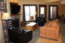 1351 Gerry Sorensen Way Unit# E2-D, Kimberley, BC  - Indoor Photo Showing Living Room With Fireplace 