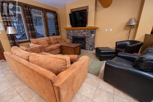 1351 Gerry Sorensen Way Unit# M2-A, Kimberley, BC - Indoor Photo Showing Living Room With Fireplace