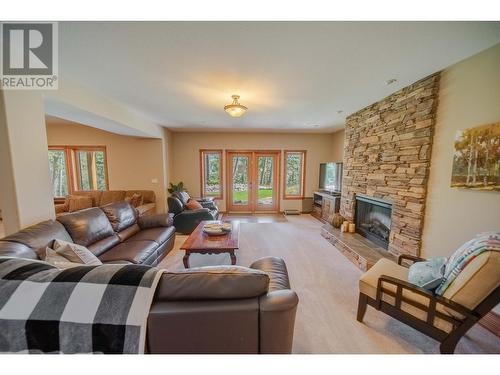 9865 Osprey Landing Drive, Wardner, BC - Indoor Photo Showing Living Room With Fireplace