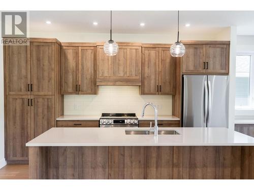 153 The Whins, Cranbrook, BC - Indoor Photo Showing Kitchen With Stainless Steel Kitchen With Double Sink With Upgraded Kitchen