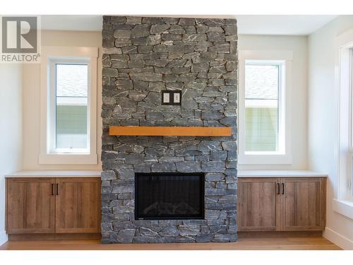 153 The Whins, Cranbrook, BC - Indoor Photo Showing Living Room With Fireplace