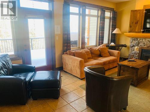 1351 Gerry Sorensen Way Unit# J2-D, Kimberley, BC - Indoor Photo Showing Living Room With Fireplace