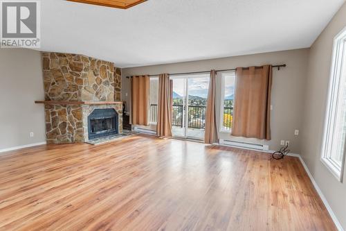 2303 Crawford  Street Unit# 1/2/3, Creston, BC - Indoor Photo Showing Living Room With Fireplace