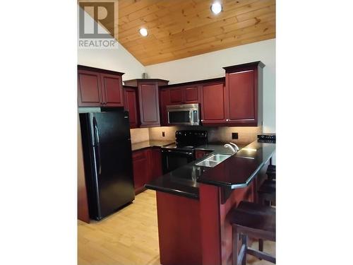 453 13Th  Avenue, Invermere, BC - Indoor Photo Showing Kitchen With Double Sink