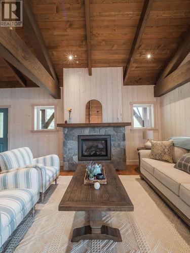 23 Birch Bend Grove, Kaslo, BC - Indoor Photo Showing Living Room With Fireplace