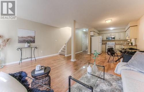 E29 - 85 Bankside Drive, Kitchener, ON - Indoor Photo Showing Living Room