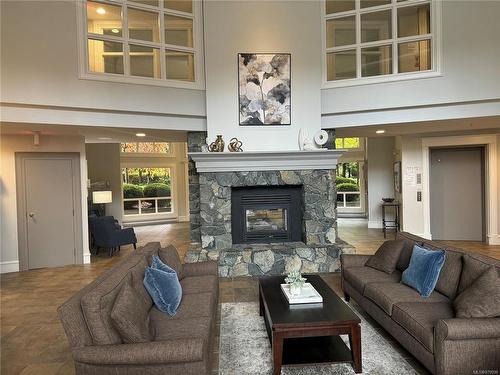 216-5650 Edgewater Lane, Nanaimo, BC - Indoor Photo Showing Living Room With Fireplace