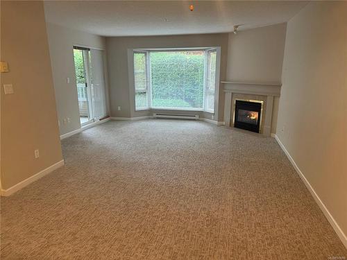 216-5650 Edgewater Lane, Nanaimo, BC - Indoor Photo Showing Other Room With Fireplace