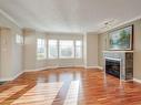 111-4480 Chatterton Way, Saanich, BC  - Indoor Photo Showing Living Room With Fireplace 