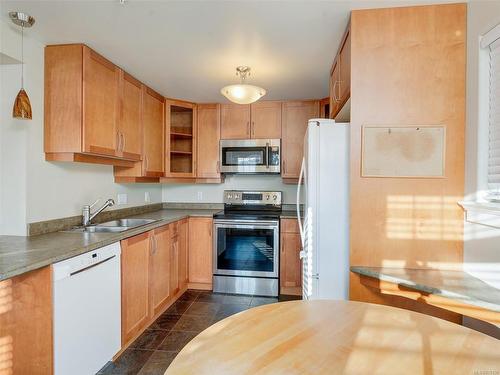 111-4480 Chatterton Way, Saanich, BC - Indoor Photo Showing Kitchen With Double Sink