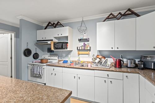 490B Hein Road, Kelowna, BC - Indoor Photo Showing Kitchen With Double Sink