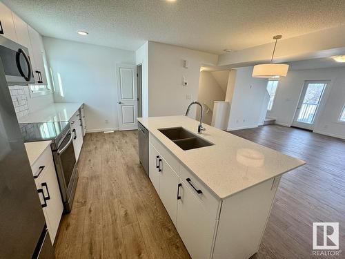 485 Desrochers Bv Sw, Edmonton, AB - Indoor Photo Showing Kitchen With Double Sink