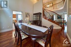 open-to-above dining room with large windows - 