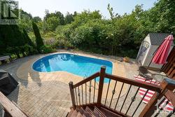 landscaped backyard with large in-ground pool, perfect for summer gatherings! - 