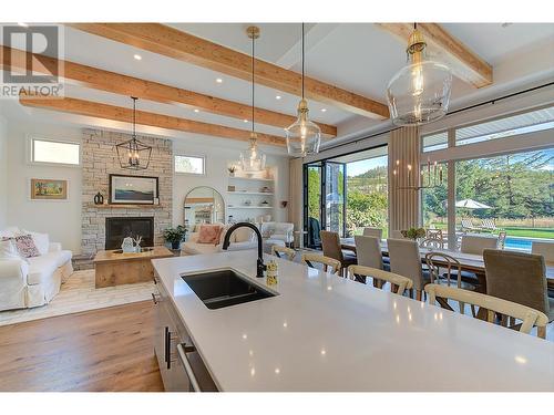 3813 Gallaghers Parkway, Kelowna, BC - Indoor Photo Showing Kitchen With Fireplace With Double Sink