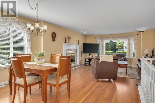 203 Biggar Road, Kelowna, BC - Indoor Photo Showing Dining Room With Fireplace