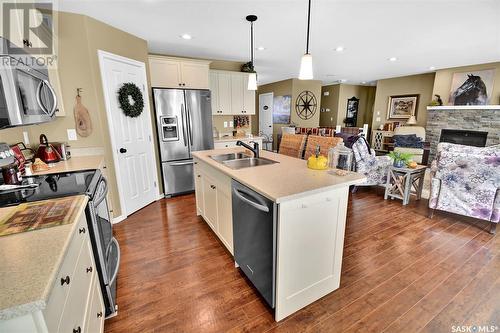 128 Mcdonald Street, Aberdeen, SK - Indoor Photo Showing Kitchen With Fireplace With Double Sink With Upgraded Kitchen