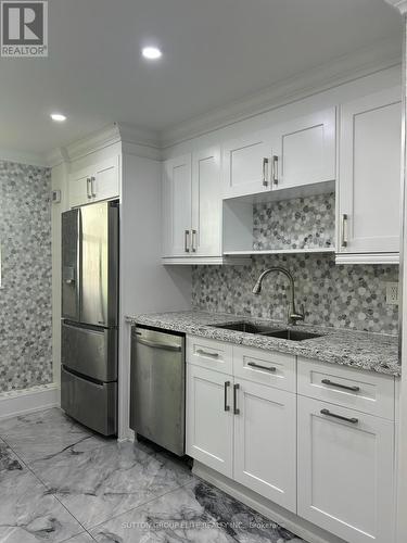 1006 - 100 Wingarden Court, Toronto, ON - Indoor Photo Showing Kitchen With Stainless Steel Kitchen With Upgraded Kitchen