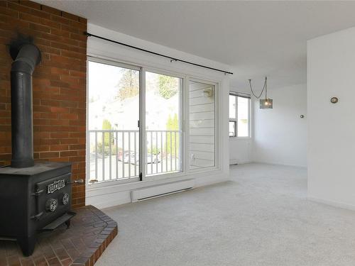 210-205 1St St, Courtenay, BC - Indoor Photo Showing Other Room With Fireplace