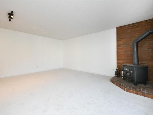 210-205 1St St, Courtenay, BC - Indoor Photo Showing Other Room With Fireplace