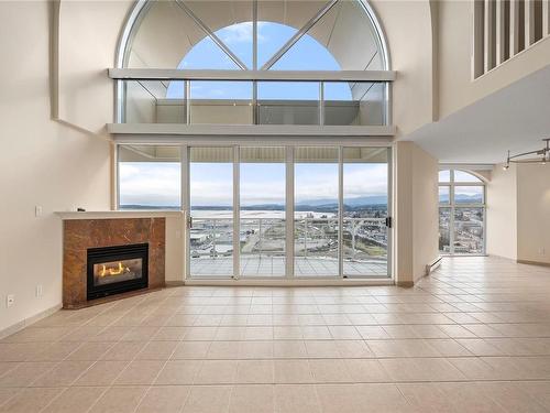 2602-154 Promenade Dr, Nanaimo, BC - Indoor Photo Showing Living Room With Fireplace