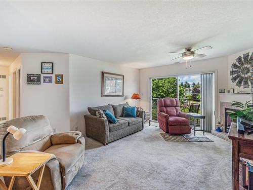 203-435 Morison Ave, Parksville, BC - Indoor Photo Showing Living Room With Fireplace