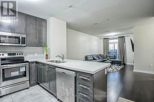 407 - 39 New Delhi Drive, Markham, ON - Indoor Photo Showing Kitchen With Stainless Steel Kitchen With Double Sink