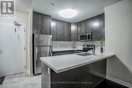 407 - 39 New Delhi Drive, Markham, ON - Indoor Photo Showing Kitchen With Stainless Steel Kitchen With Double Sink With Upgraded Kitchen