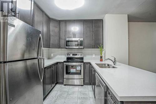 407 - 39 New Delhi Drive, Markham, ON - Indoor Photo Showing Kitchen With Stainless Steel Kitchen With Double Sink With Upgraded Kitchen