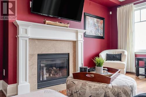 701 - 40 Trott Boulevard, Collingwood, ON - Indoor Photo Showing Living Room With Fireplace