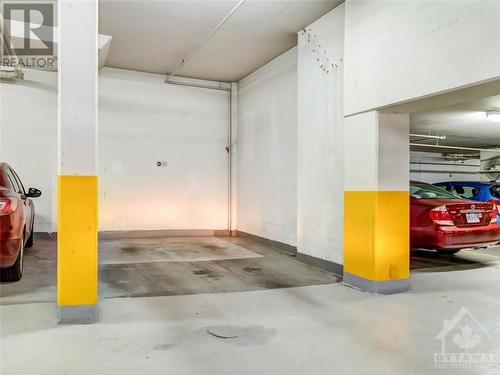 Parking Spot is conveniently located across from storage locker - 1005 Beauparc Private Unit#507, Ottawa, ON - Indoor Photo Showing Garage