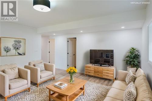 Virtually staged living area on lower level - 403 Northport Drive, Port Elgin, ON - Indoor Photo Showing Living Room