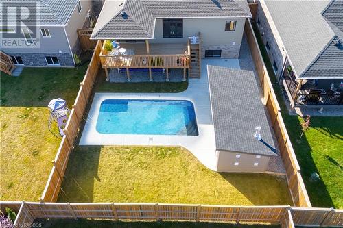 In-ground heated pool - 403 Northport Drive, Port Elgin, ON - Outdoor With In Ground Pool With Deck Patio Veranda