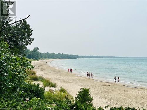 The beach is calling! Time to enjoy the lake life - 403 Northport Drive, Port Elgin, ON - Outdoor With Body Of Water With View