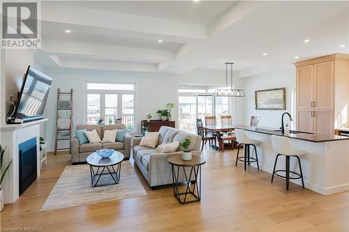 Beautiful open concept area with coffered ceilings - 403 Northport Drive, Port Elgin, ON - Indoor Photo Showing Living Room With Fireplace