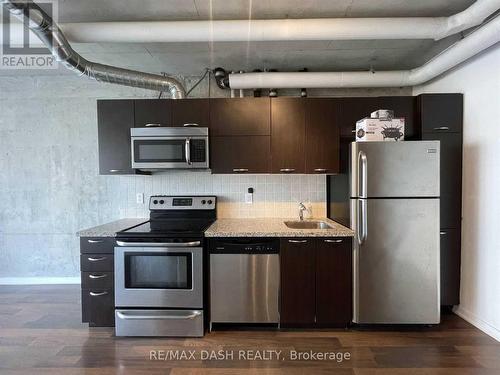 327 - 38 Joe Shuster Way, Toronto, ON - Indoor Photo Showing Kitchen With Upgraded Kitchen