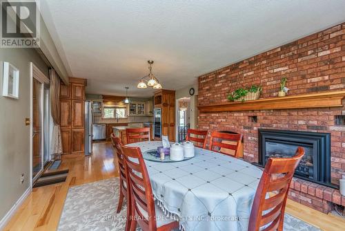 7340 Guelph Line, Milton, ON - Indoor Photo Showing Dining Room With Fireplace