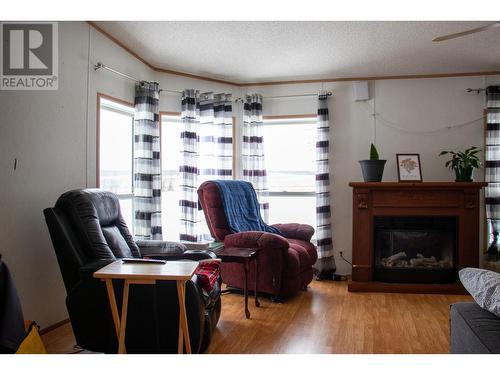 1499 Cecil Lake Road, Fort St. John, BC - Indoor Photo Showing Living Room With Fireplace