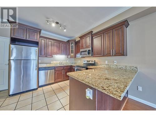 104 22363 Selkirk Avenue, Maple Ridge, BC - Indoor Photo Showing Kitchen With Stainless Steel Kitchen