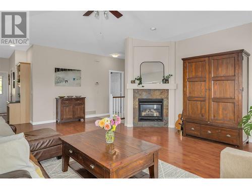 5199 Cobble Crescent, Kelowna, BC - Indoor Photo Showing Living Room With Fireplace