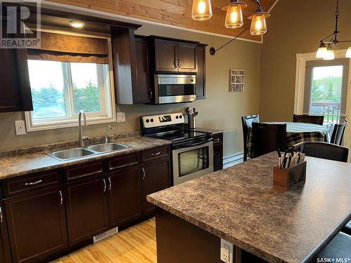 104 Sunridge Road, Pebble Baye, SK - Indoor Photo Showing Kitchen With Double Sink