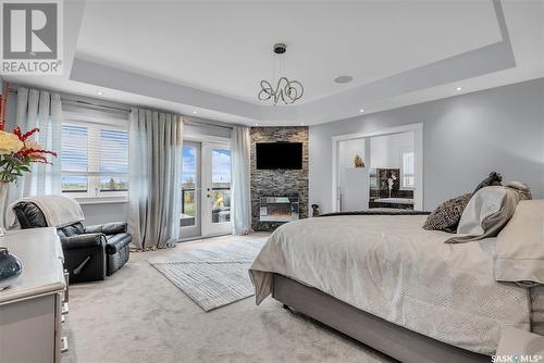 104 Aspen Way, Aberdeen Rm No. 373, SK - Indoor Photo Showing Bedroom With Fireplace