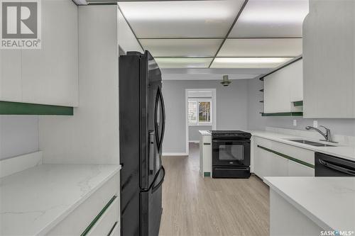 1024 Gryphons Walk, Regina, SK - Indoor Photo Showing Kitchen With Double Sink