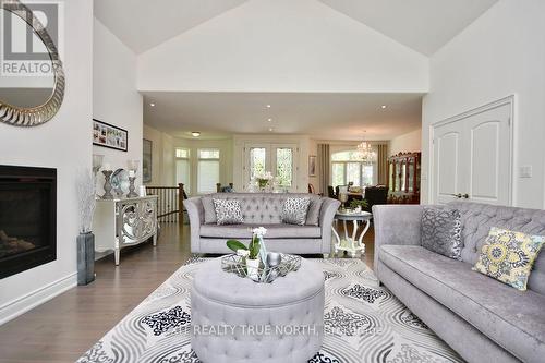 2 Sycamore Circle, Springwater, ON - Indoor Photo Showing Living Room With Fireplace