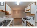 284 Yorkton Avenue Unit# 404, Penticton, BC  - Indoor Photo Showing Kitchen With Double Sink 