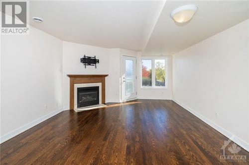 4524 Innes Road Unit#C, Ottawa, ON - Indoor Photo Showing Living Room With Fireplace