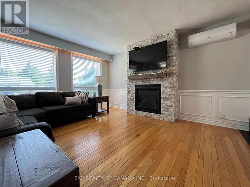 721 Churchill Street, Timmins (Upper Melrose), ON - Indoor Photo Showing Living Room With Fireplace