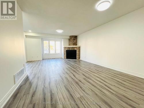 93 Sandyhook Square, Toronto, ON - Indoor Photo Showing Living Room With Fireplace